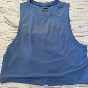 Women’s Nobull muscle tank in sky blue color. Size small.